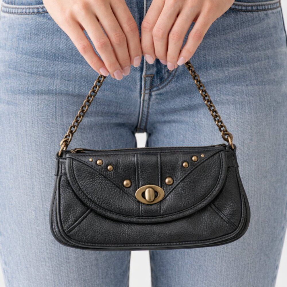 Barney's NY Charcoal Metallic leather with Brass finish rivets and wrist chain